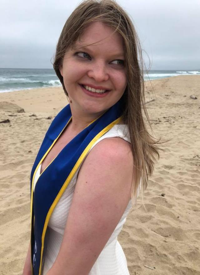 Kristy Pahel MPAc 21 graduation photo on the beach