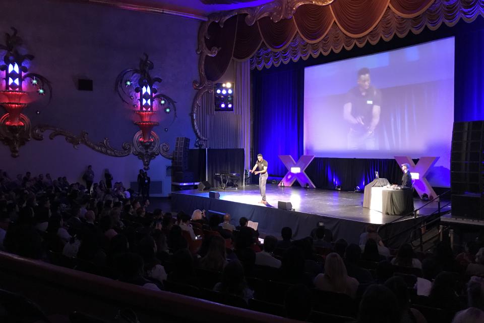 Person on stage at an event